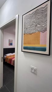 Bedroom entrance with contemporary abstract artwork