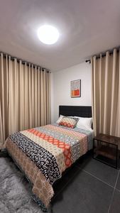 Restful bedroom with soft drapes and layered textiles